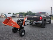 Chipease D1500E wood chipper being towed by a truck showing towable tow bar hitch
