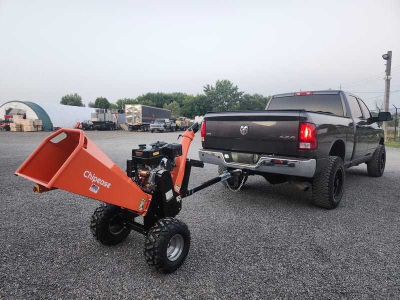 Chipease D1500E wood chipper being towed by a truck showing towable tow bar hitch