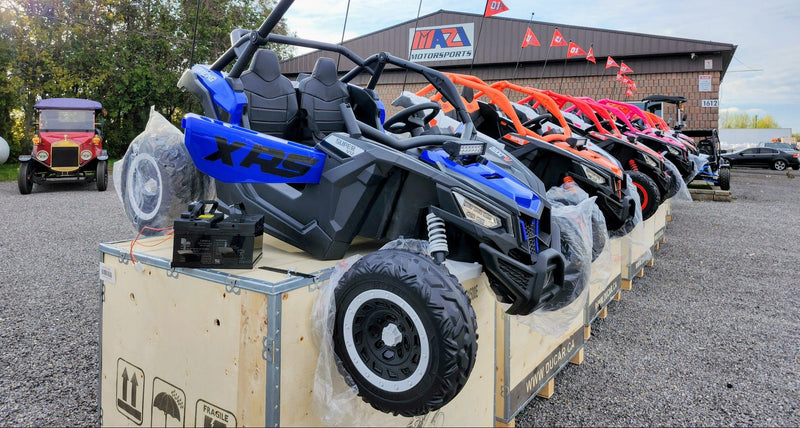 Kids Electric XRS 24V 2-seater ride-on UTV lineup in multiple colours at Mazi Motors Ontario dealership