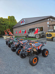Lineup of 125cc Landward Trailmaster kids gas ATV in at Mazi Motors Ontario dealership