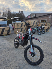 Mazi Rocket 1300W kids electric dirt bike front view with inverted fork and off-road tires