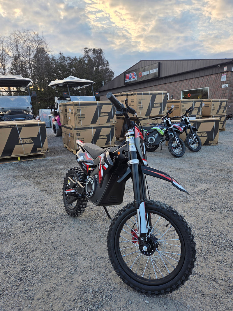 Mazi Rocket 1300W kids electric dirt bike front view with inverted fork and off-road tires